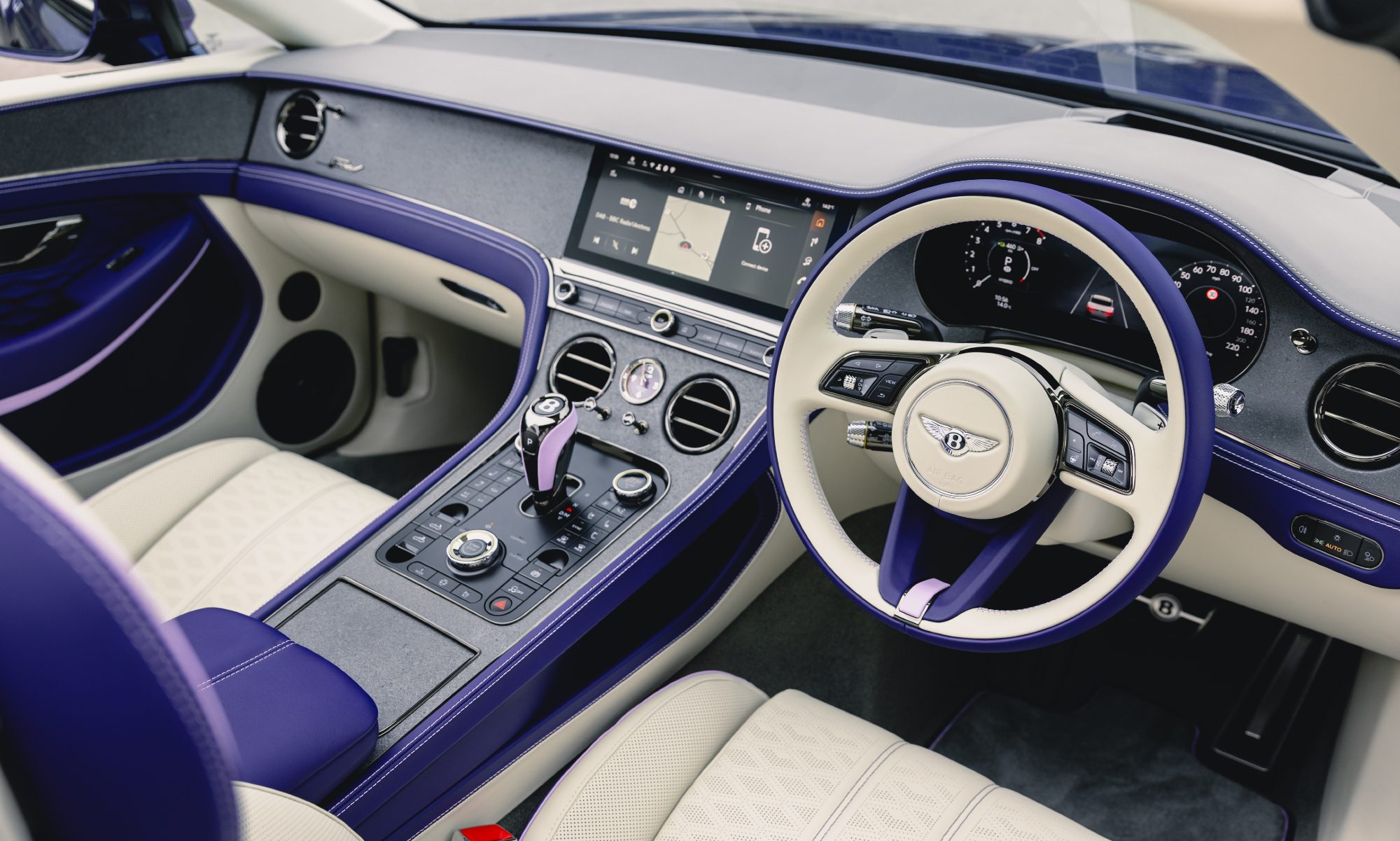 Bentley Continental GTC Speed in Violette finish with top down showing the tri-tone interior.