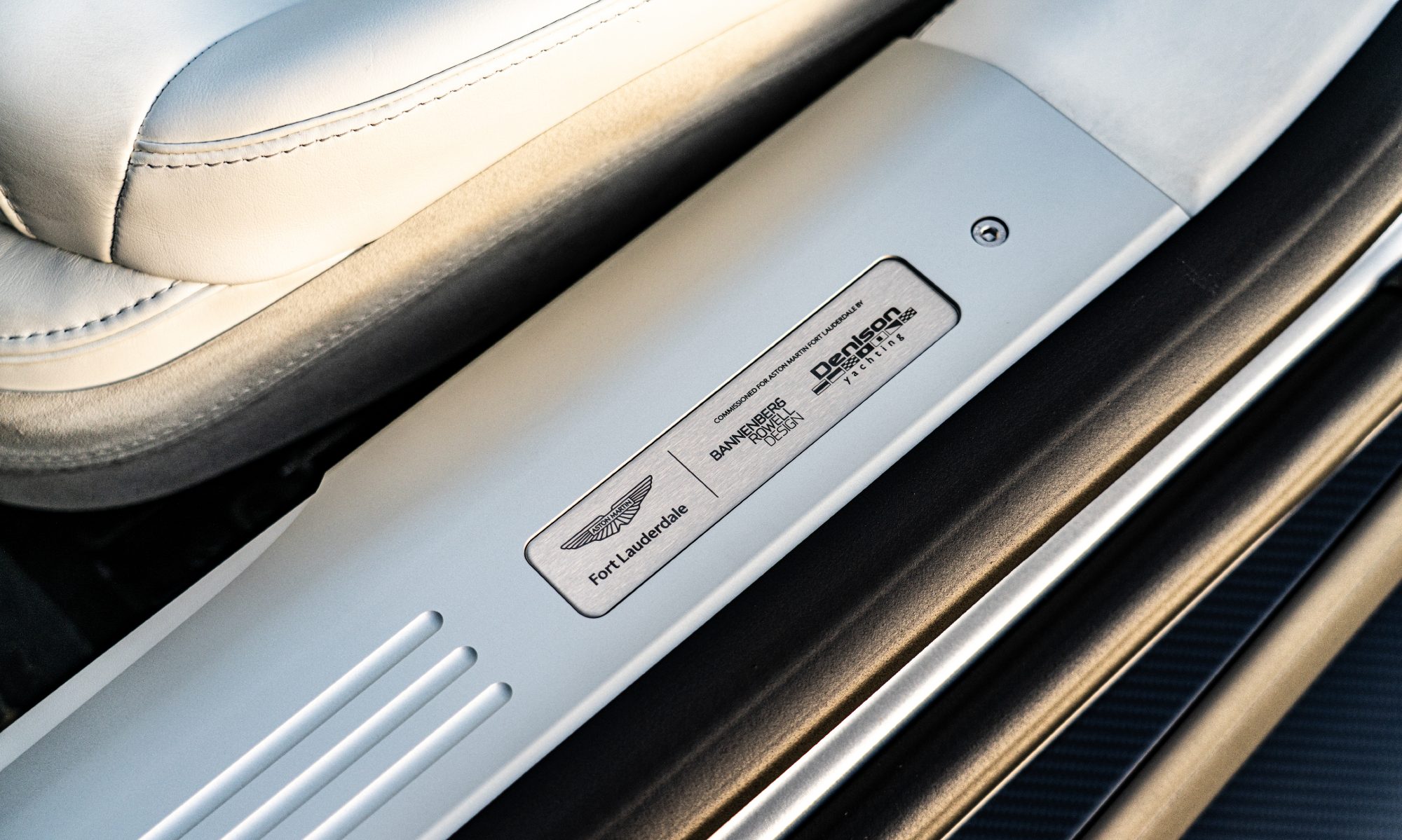 Bespoke Aston Martin V12 Vanquish models Beyond and Above detail design partners on the doorsill.