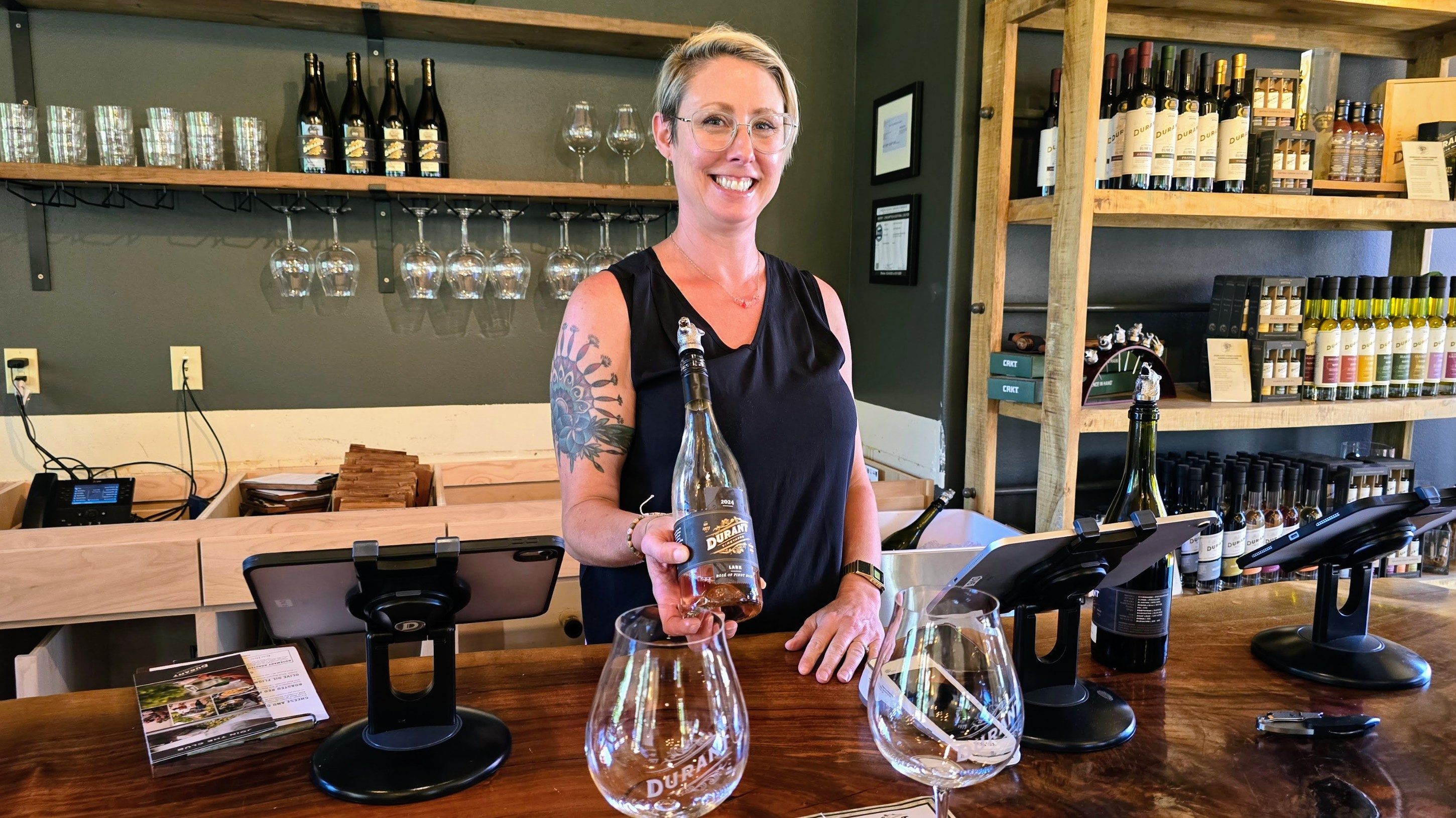A woman holding a wine bottle