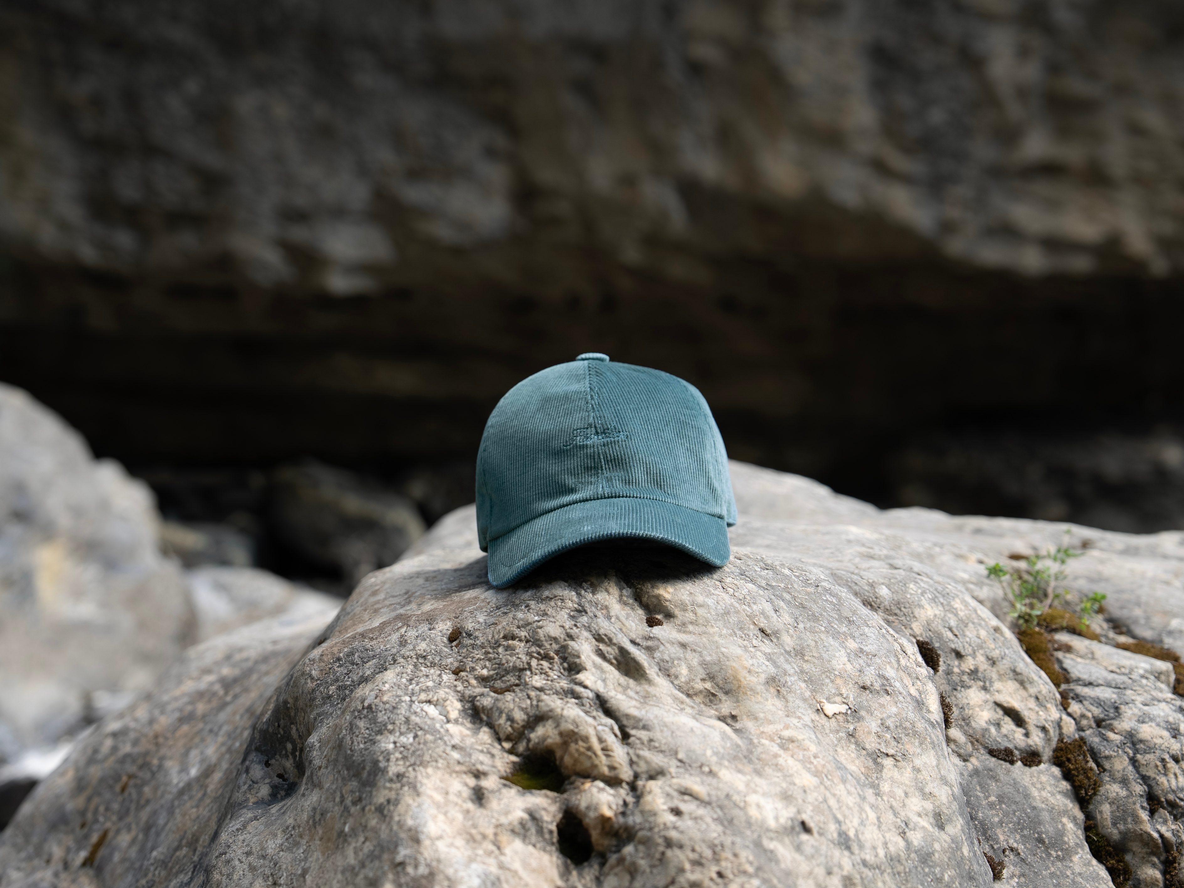 Baseball cap on rock