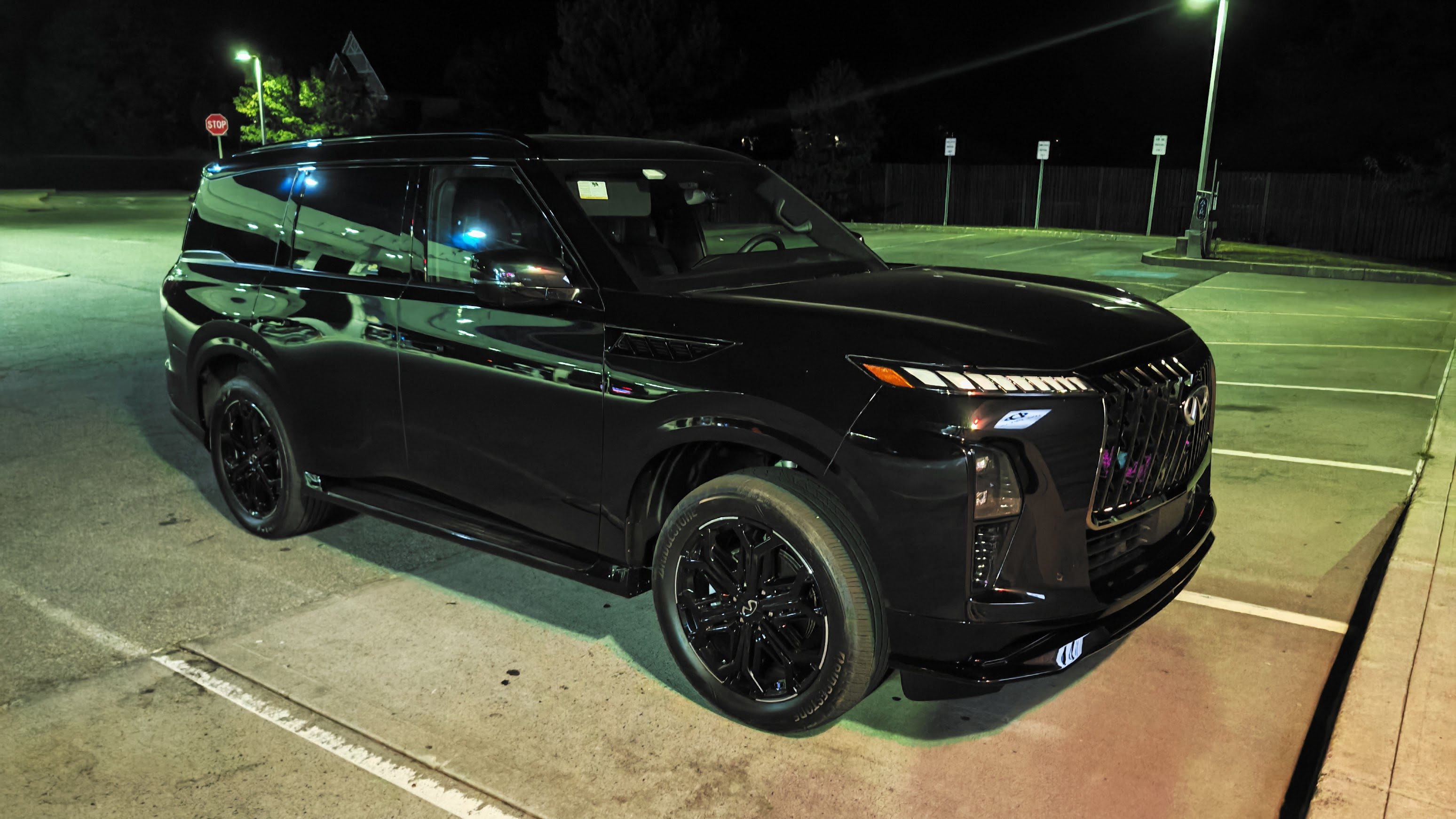 Infiniti QX80 Sport Front 3/4 view at night