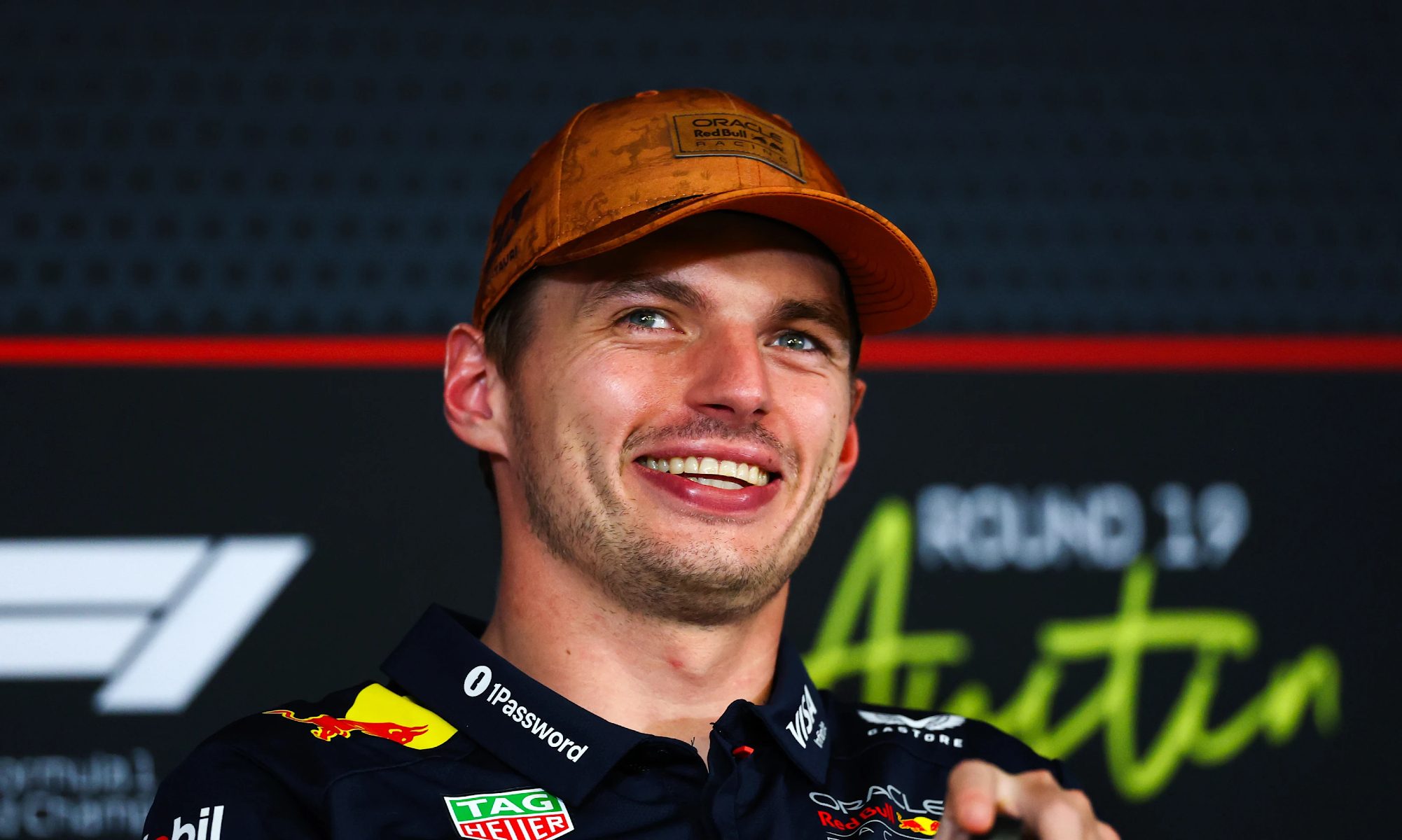 Max Verstappen smiling after winning the US Grand Prix.
