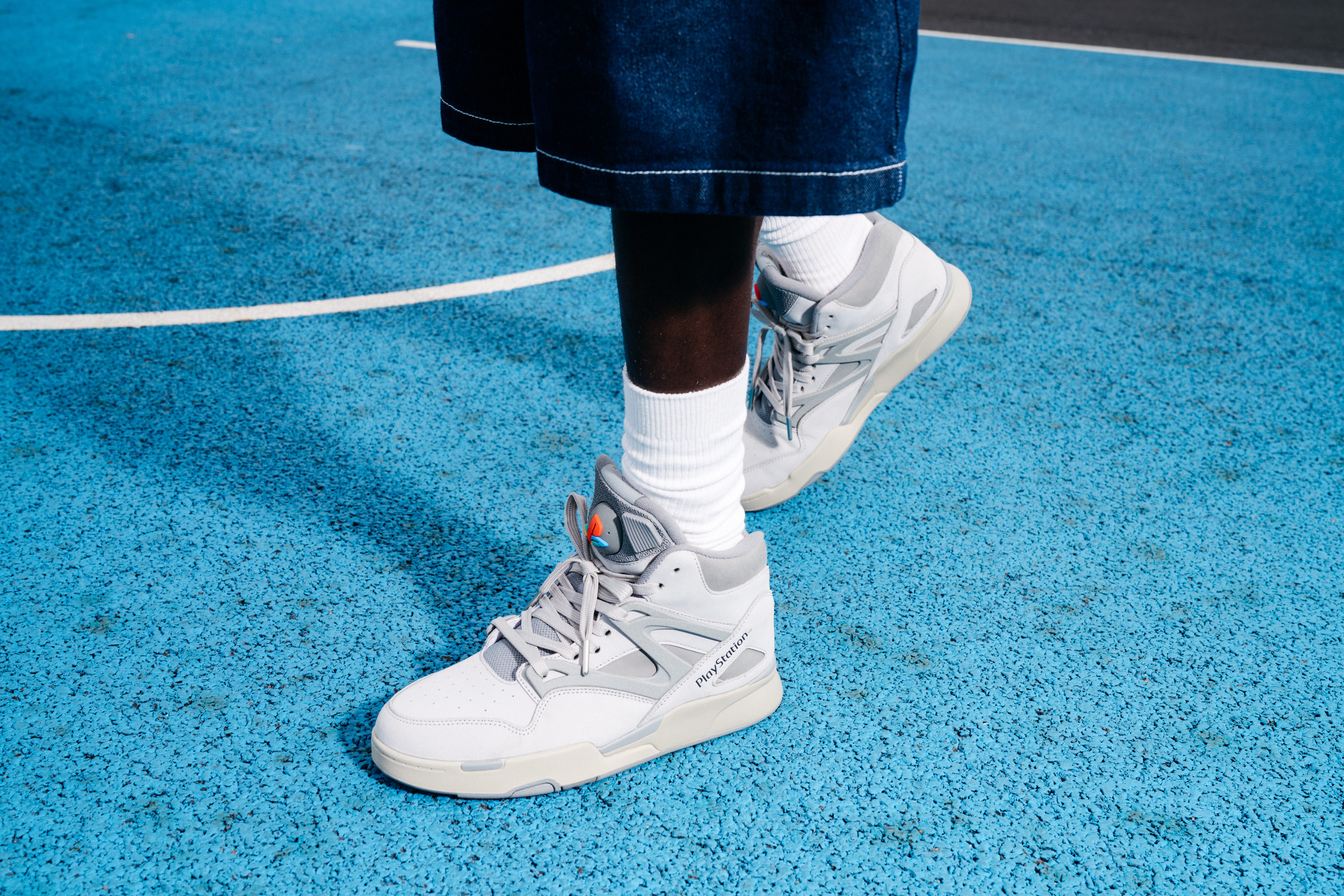 man wearing reebok x playstation sneaker