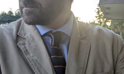 Tan canvas jacket with tie close up