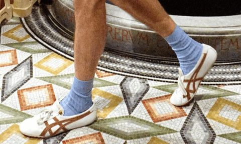 model wearing onitsuka tiger x versace sneakers