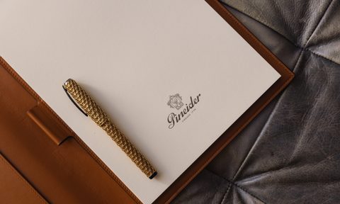 Pineider pen on note