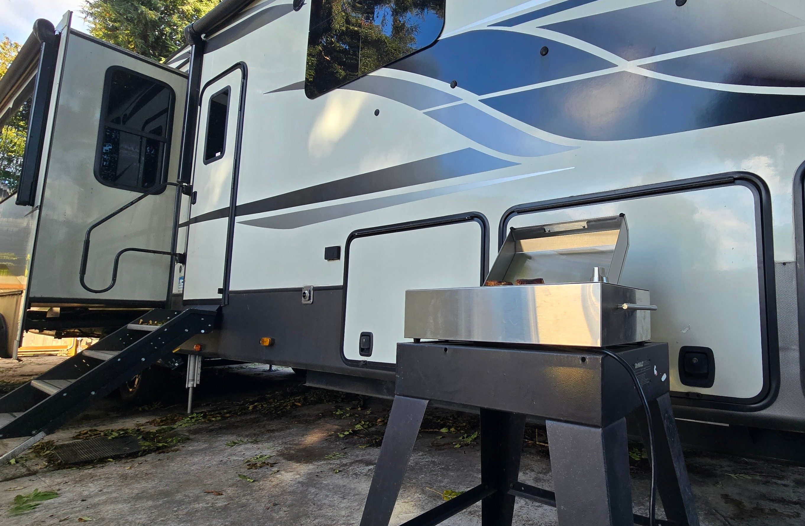 A Kenyon City Grill in front of an RV