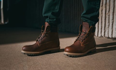 man wearing brown boots