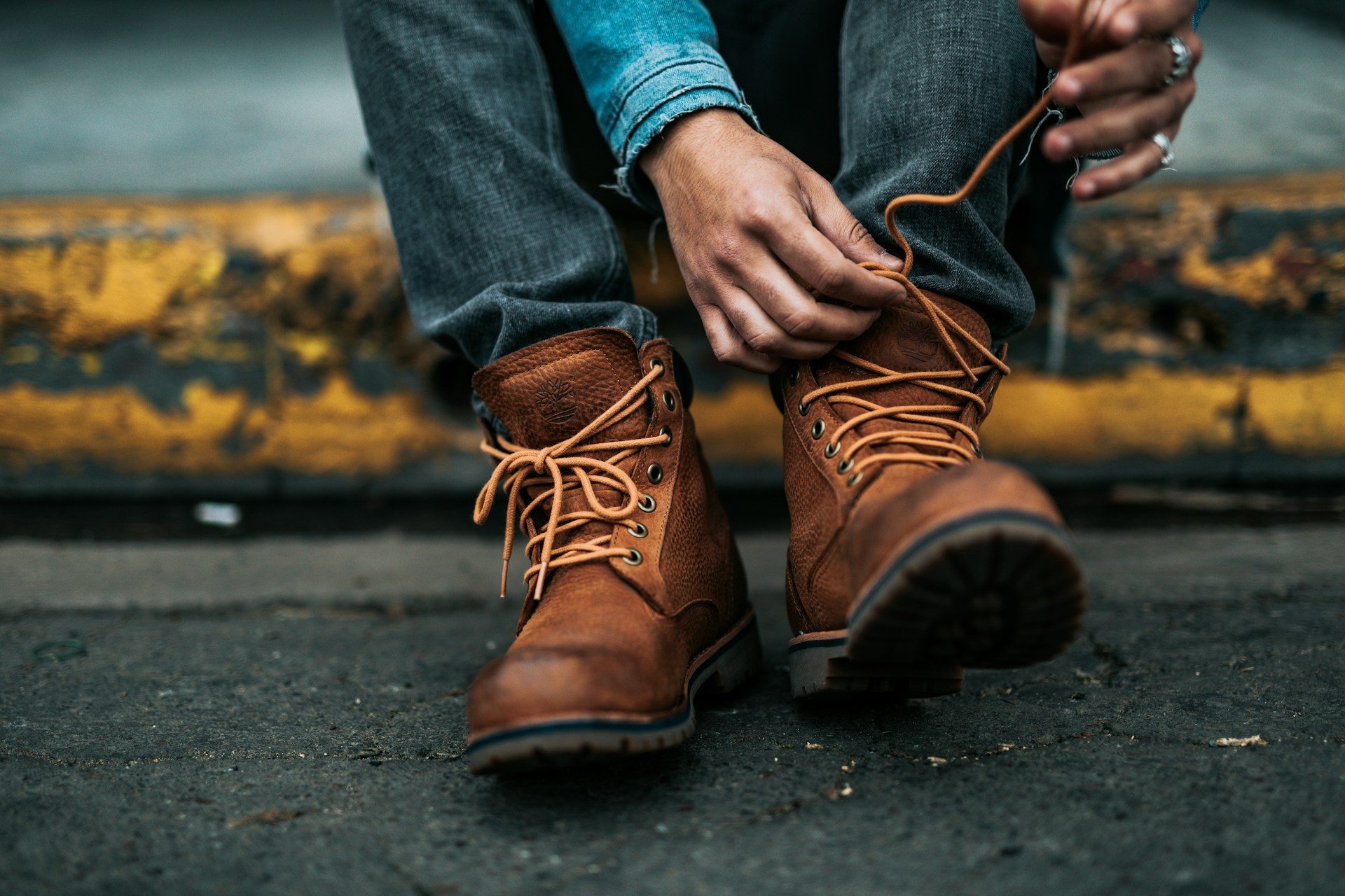 man tying boots