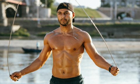Man skipping jump rope workout