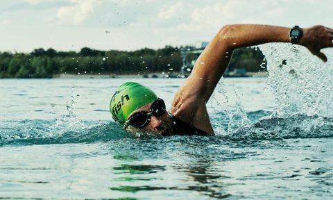 man swimming in open water