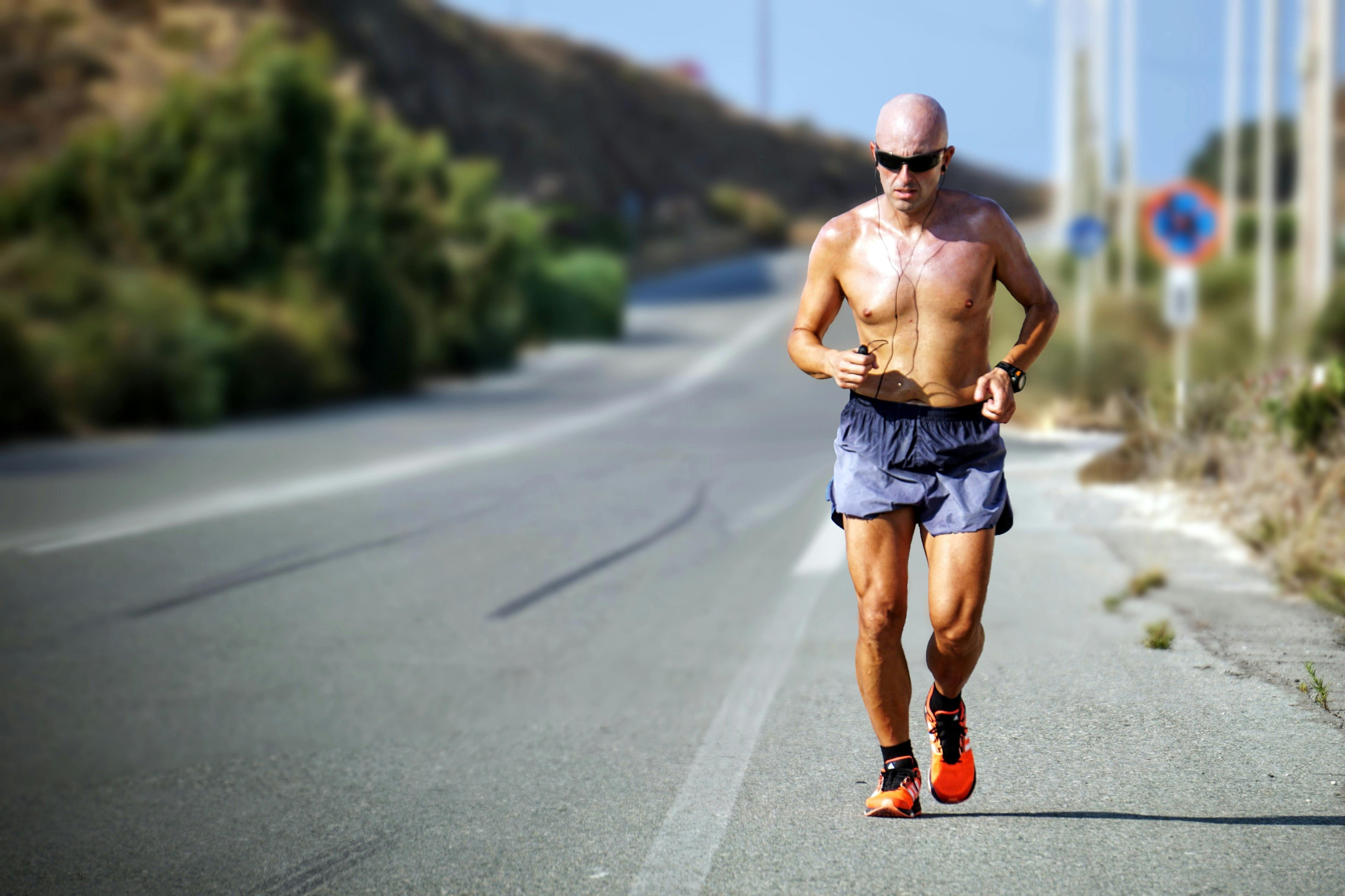 Man running on road.