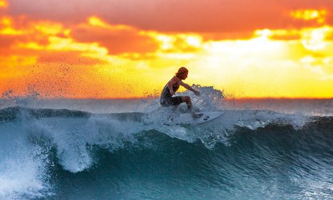 man surfing waves