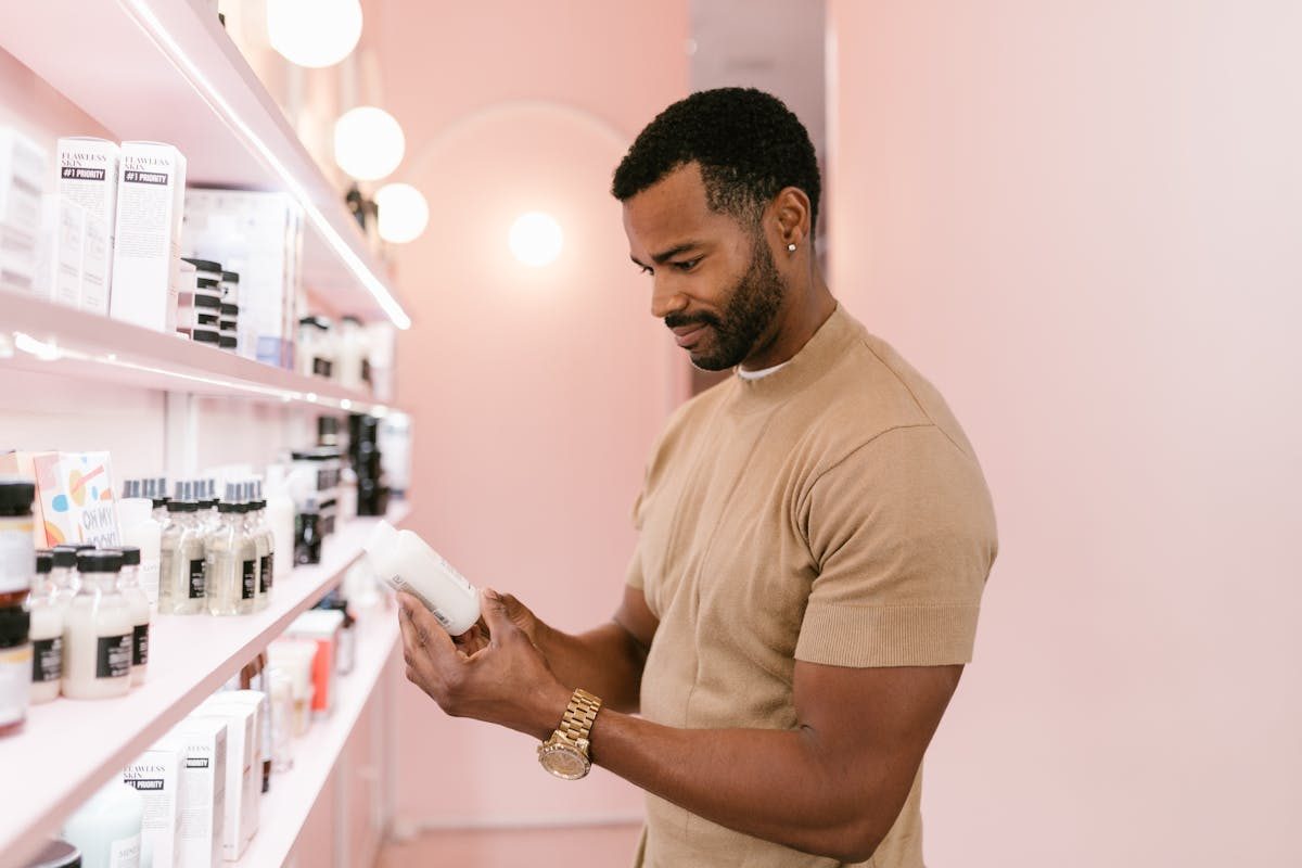 a man looking at hair products