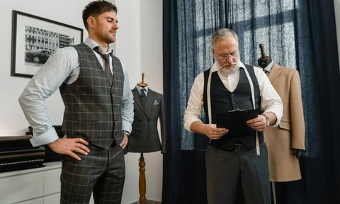 man dress shop taking measurements