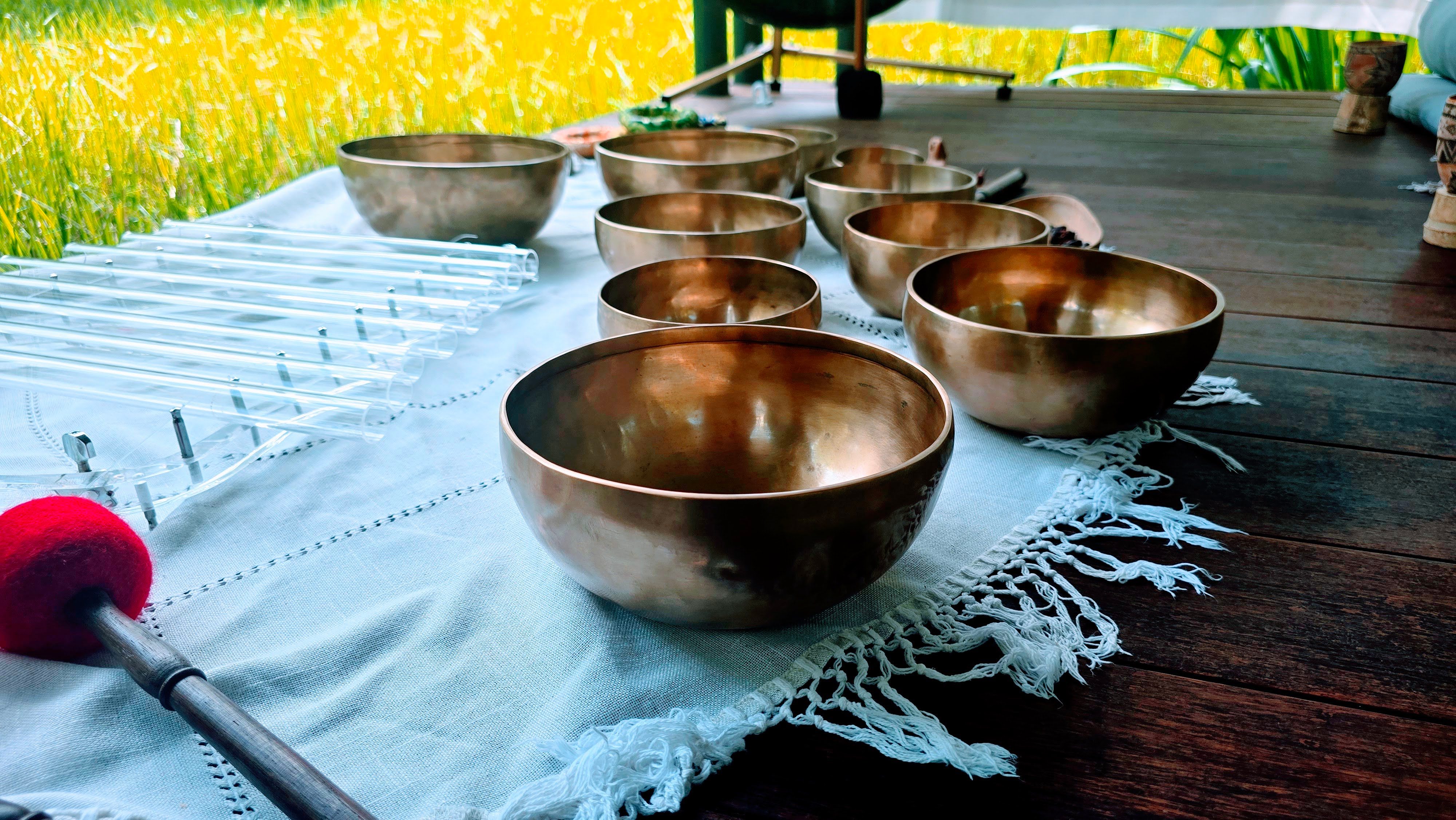 Singing bowls sitting on a sheet
