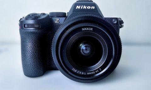 The Nikon S5 II camera sitting on a white surface