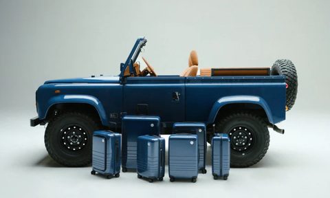 Mono x Brooklyn Coachworks Land Rover Defender 90 left profile shot with six pieces of Monos luggage.
