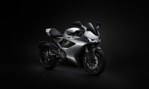 Norton Manx R right front three quarter view with dark background.
