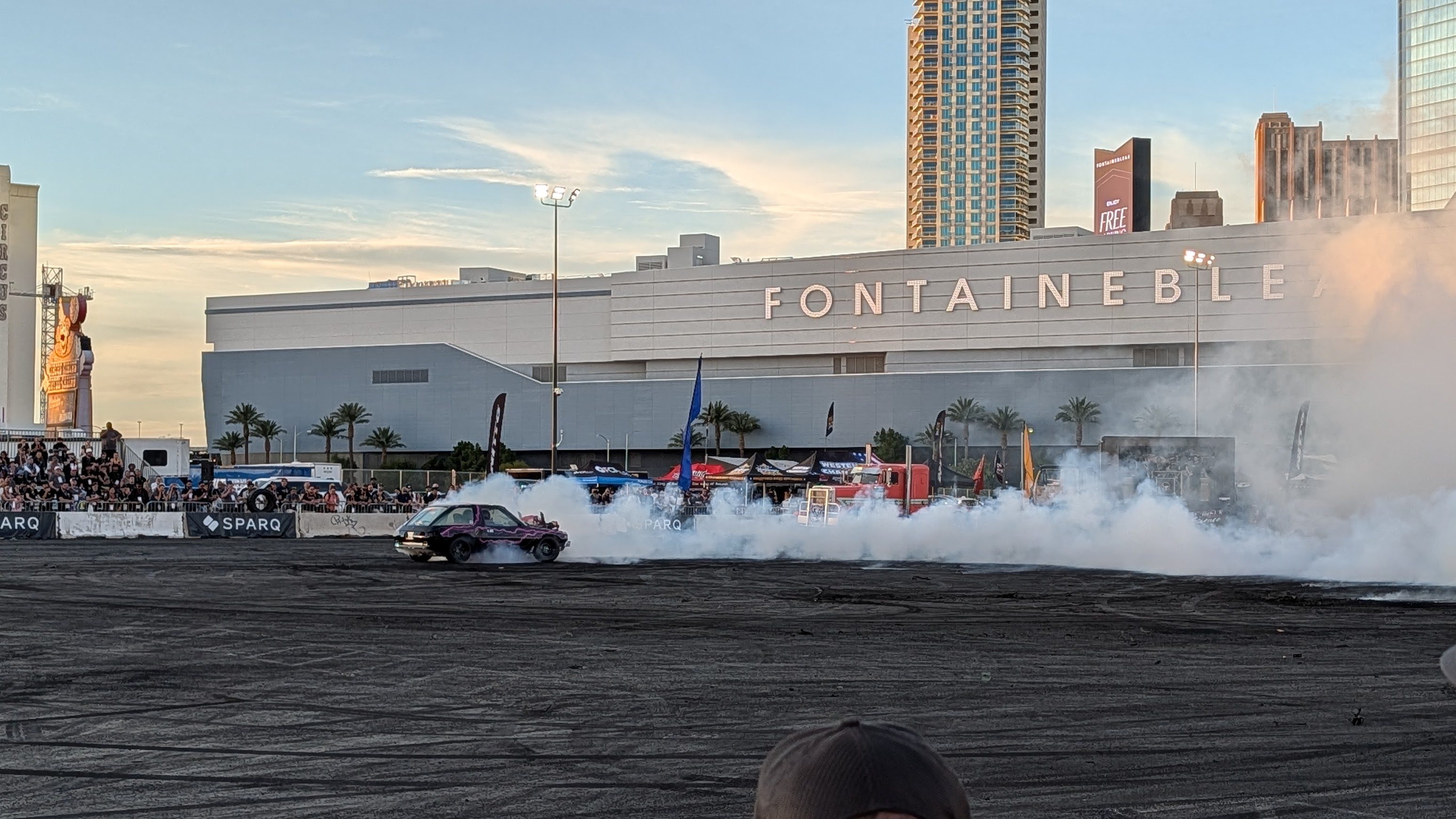 A car spinning out with tire smoke at the SEMA HorsePower Rodeo