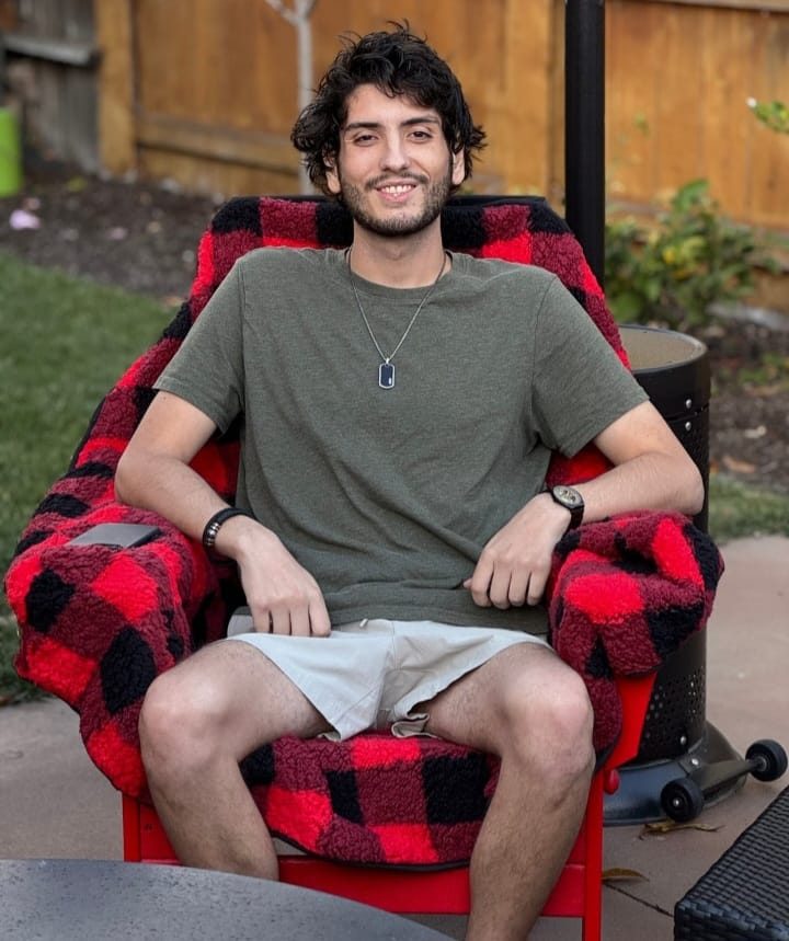A red and black plaid chair blanket