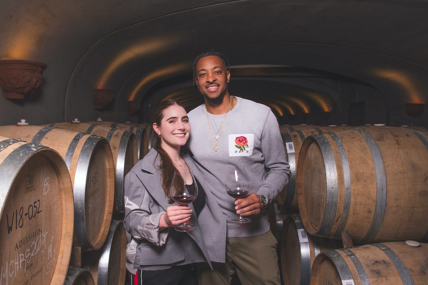 CJ and Elise McCollum in wine cellar.