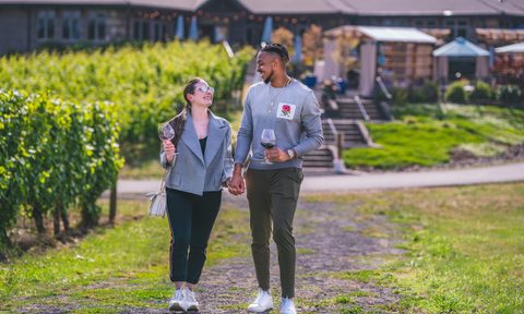 CJ and Elise McCollum in a vineyard.