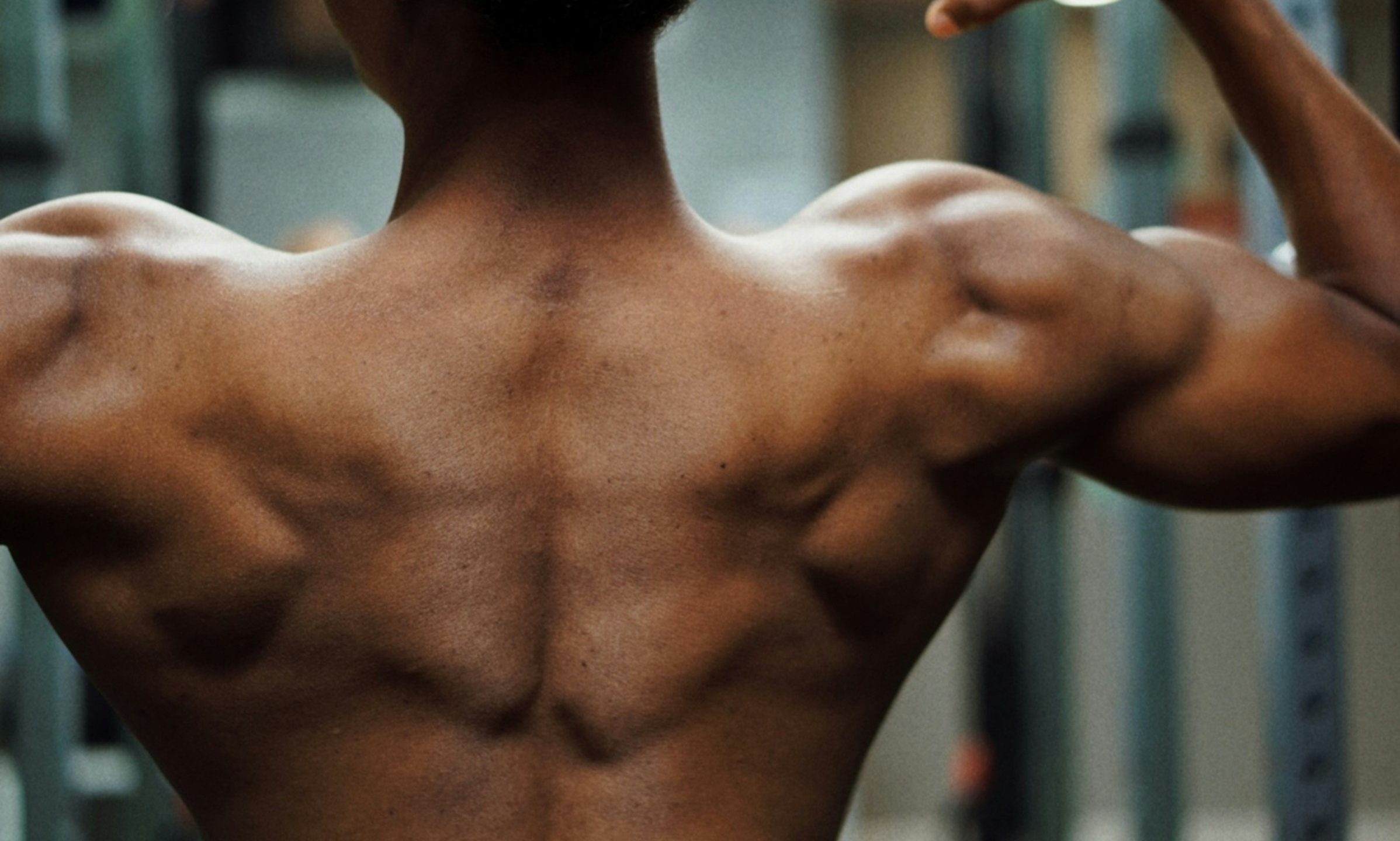 man muscle flex shoulder