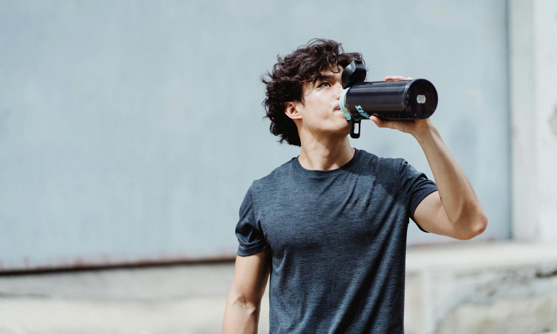 man drinking protein shake