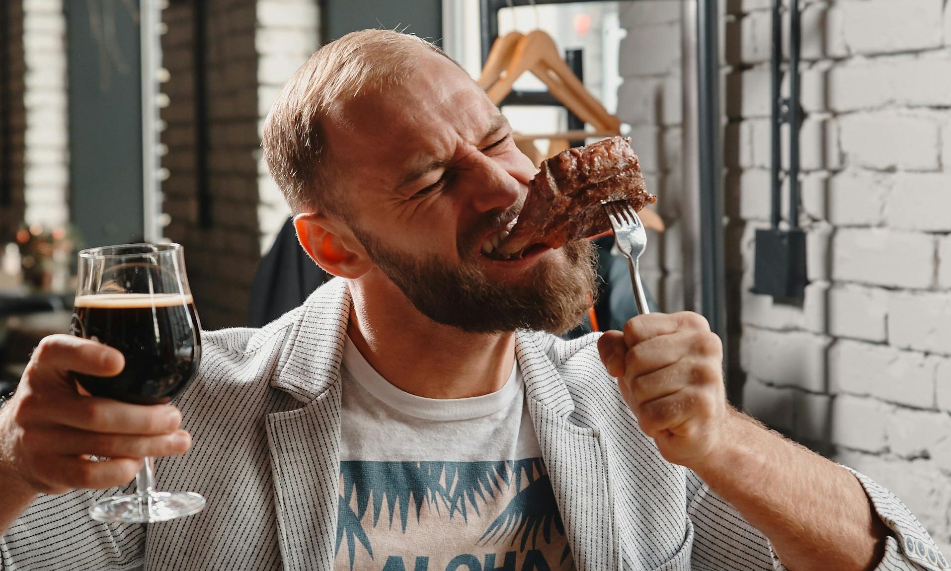 man eating meat for dinner