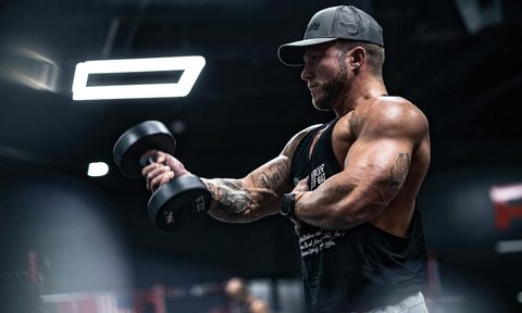 man weightlifting in the gym bicep curl