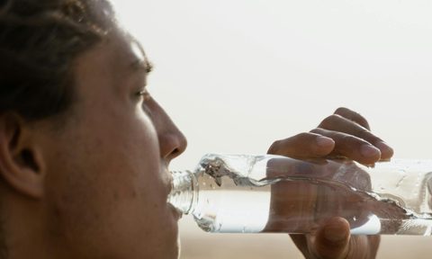 man drinking water