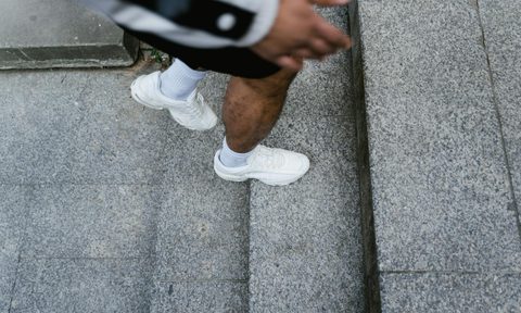 man stepping up on stairs exercise