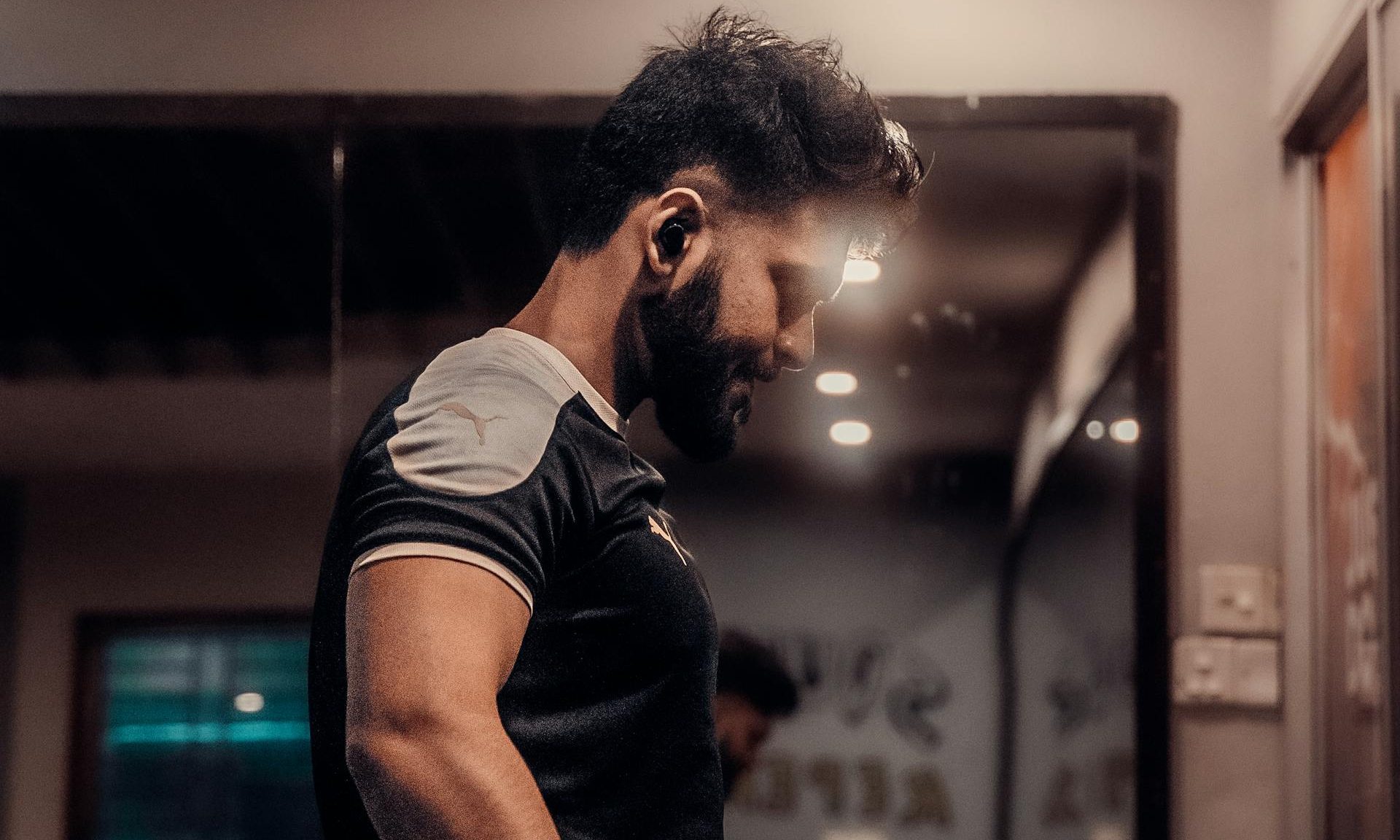 man holding dumbbells working out weightlifting