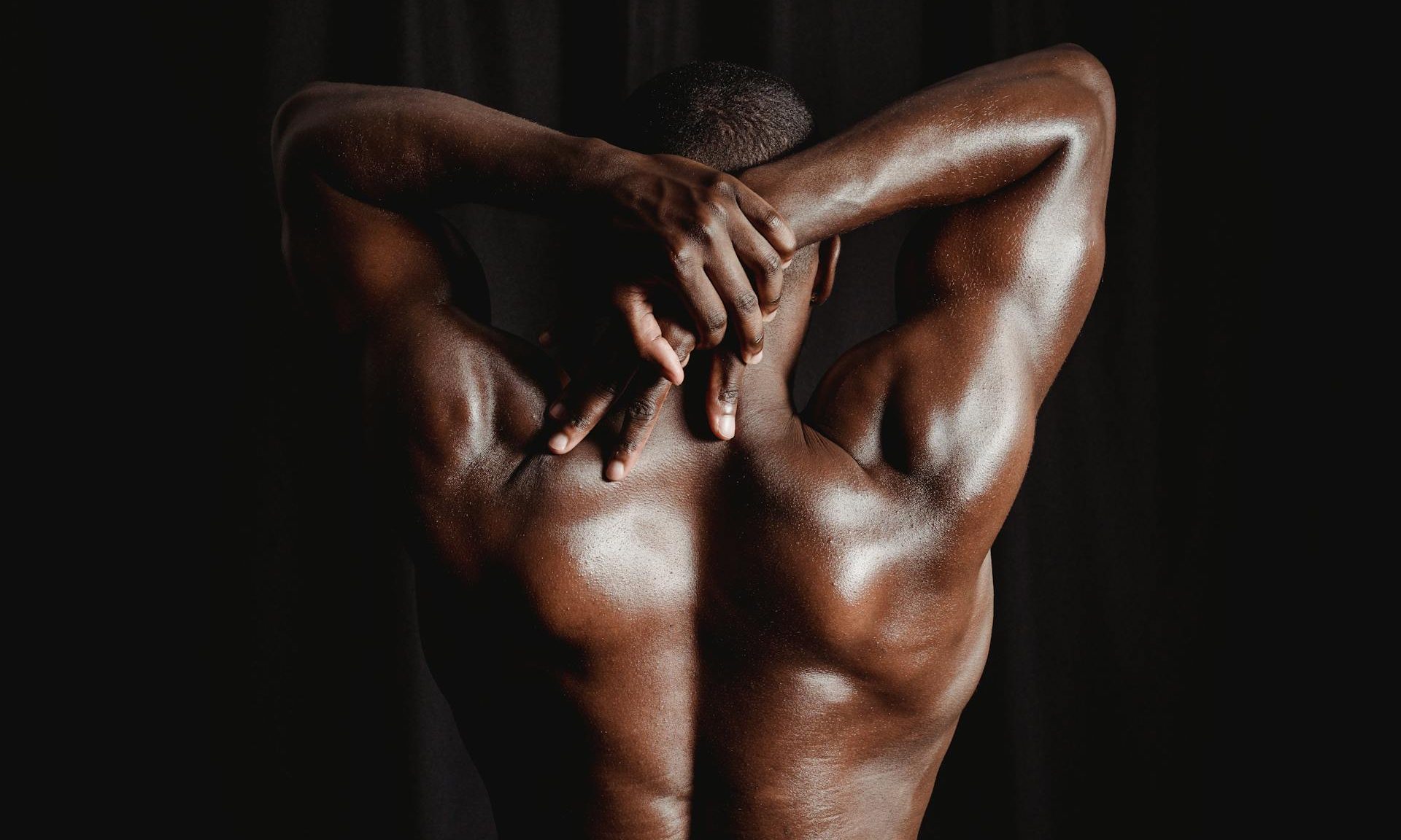 man stretching back and shoulders