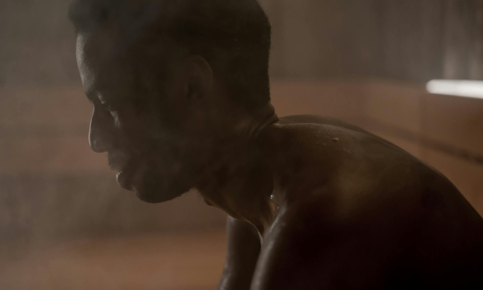 man in sauna sweating