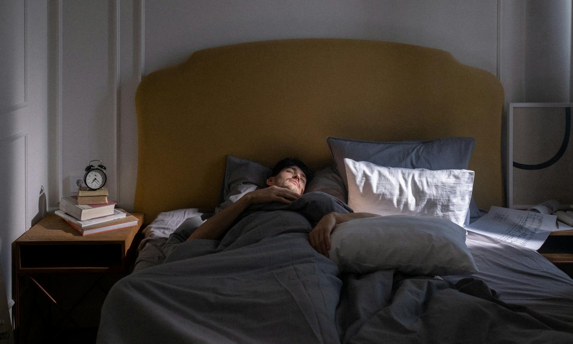 man sleeping in bed