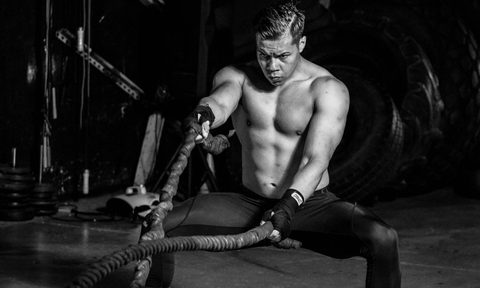 man exercising workout ropes HIIT high intensity interval training
