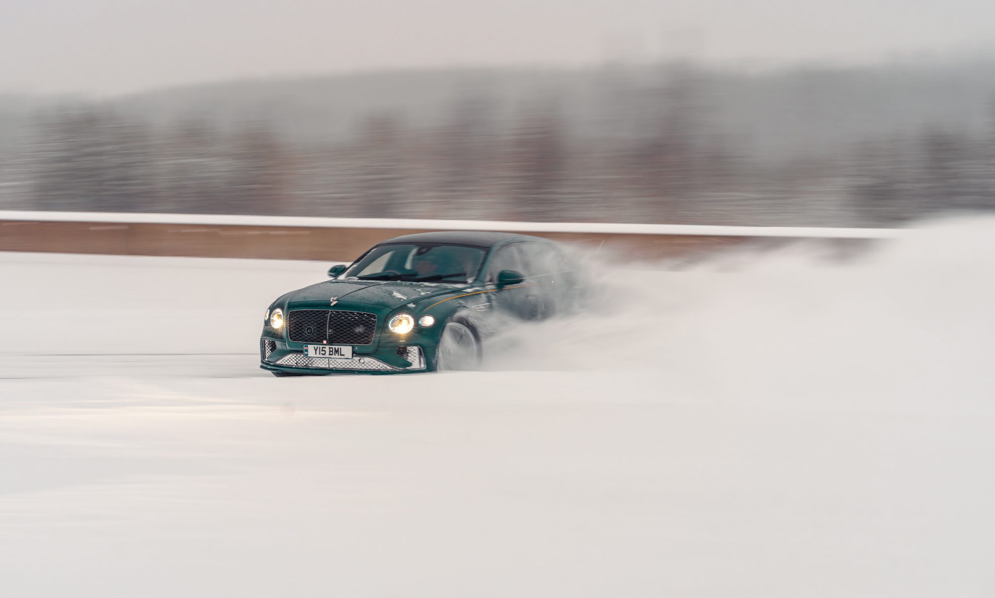 Bentley Fly Spur Speed racing on ice left front three quarter view.