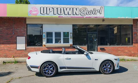 2025 Mustang in front of a dilapidated ice cream store