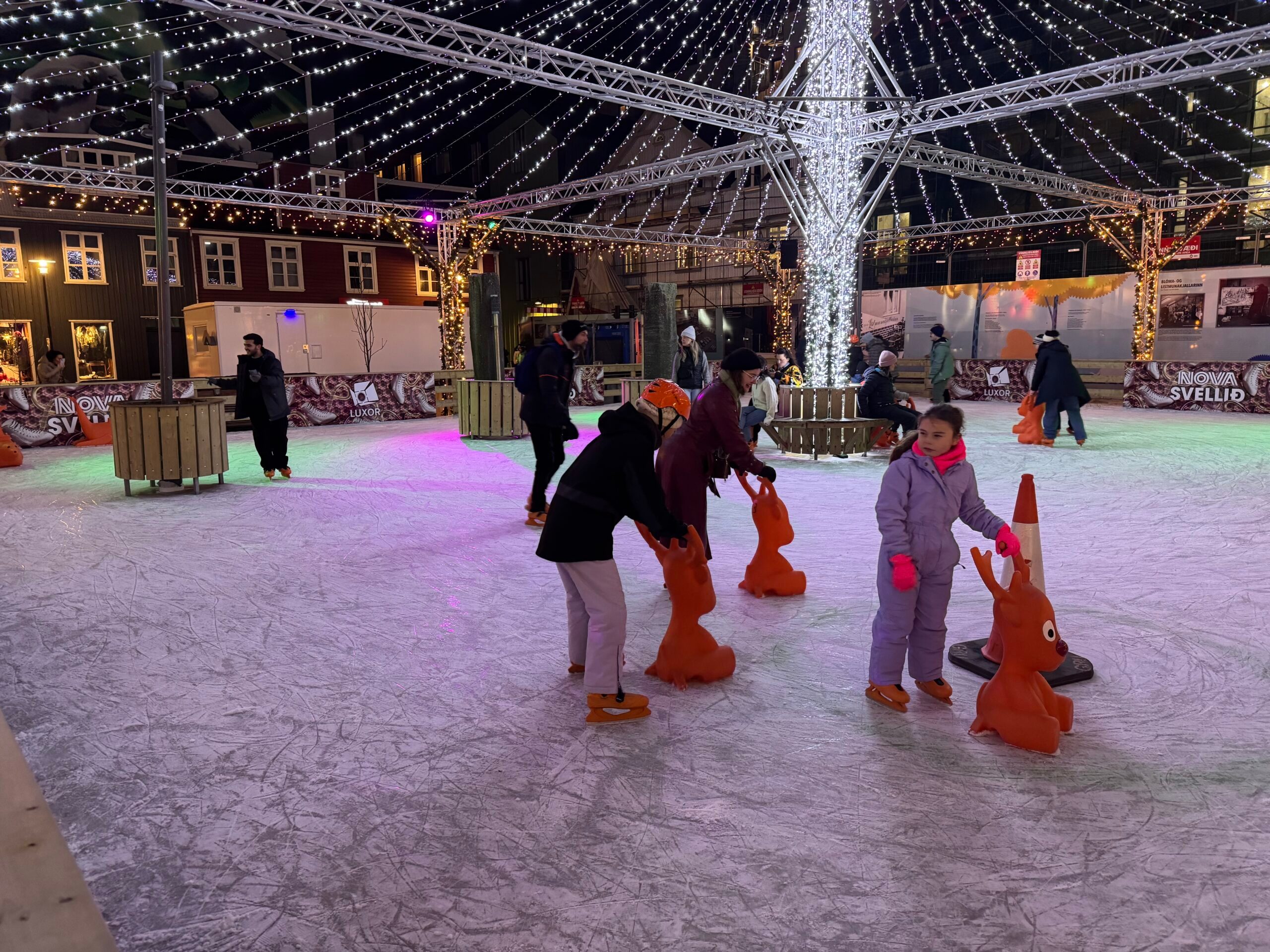 People ice skating at Ice Skating at Ingólfstorg Square.