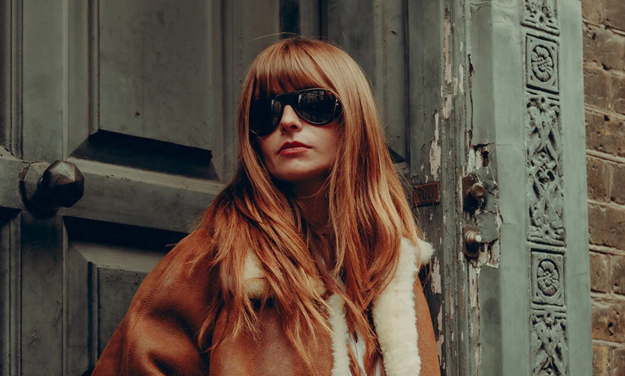 Model wearing Royal Enfield x Vallon Classic 650 Moto Aviators.