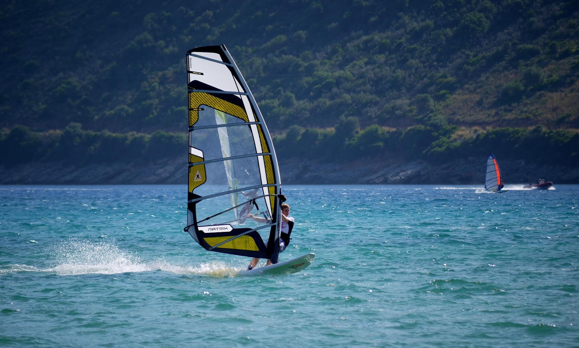 man windsurfing