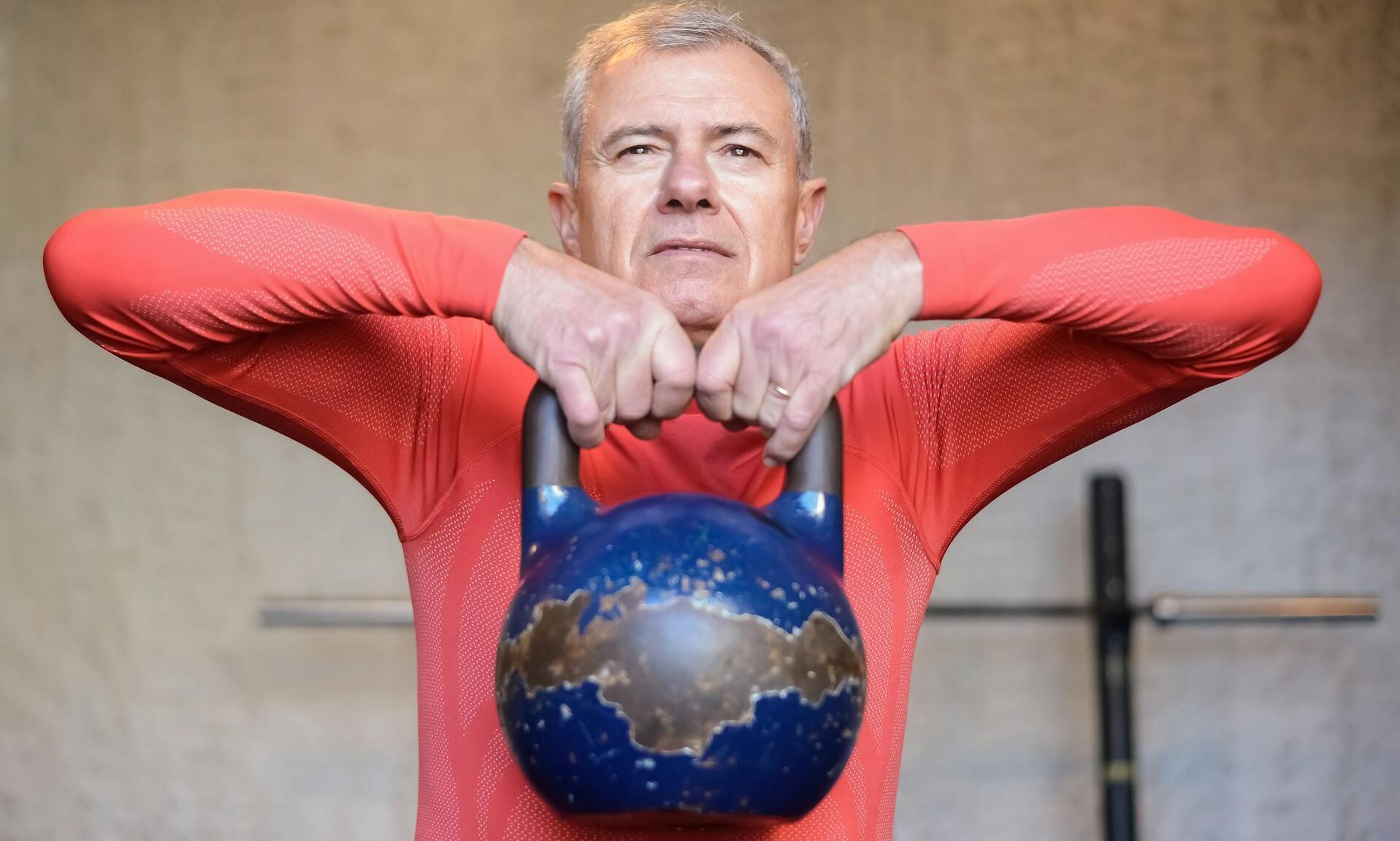 older man kettlebell training weightlifting