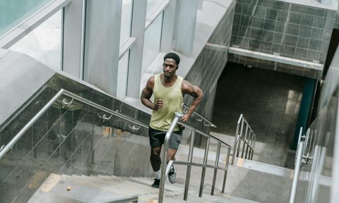 athletic man running up stairs