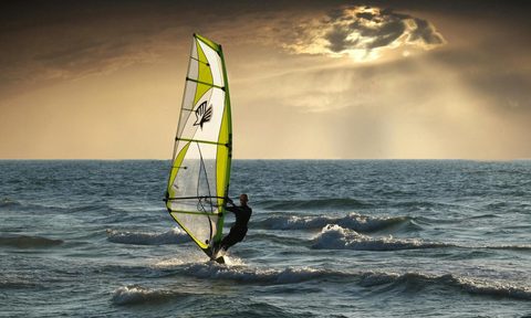 man windsurfing