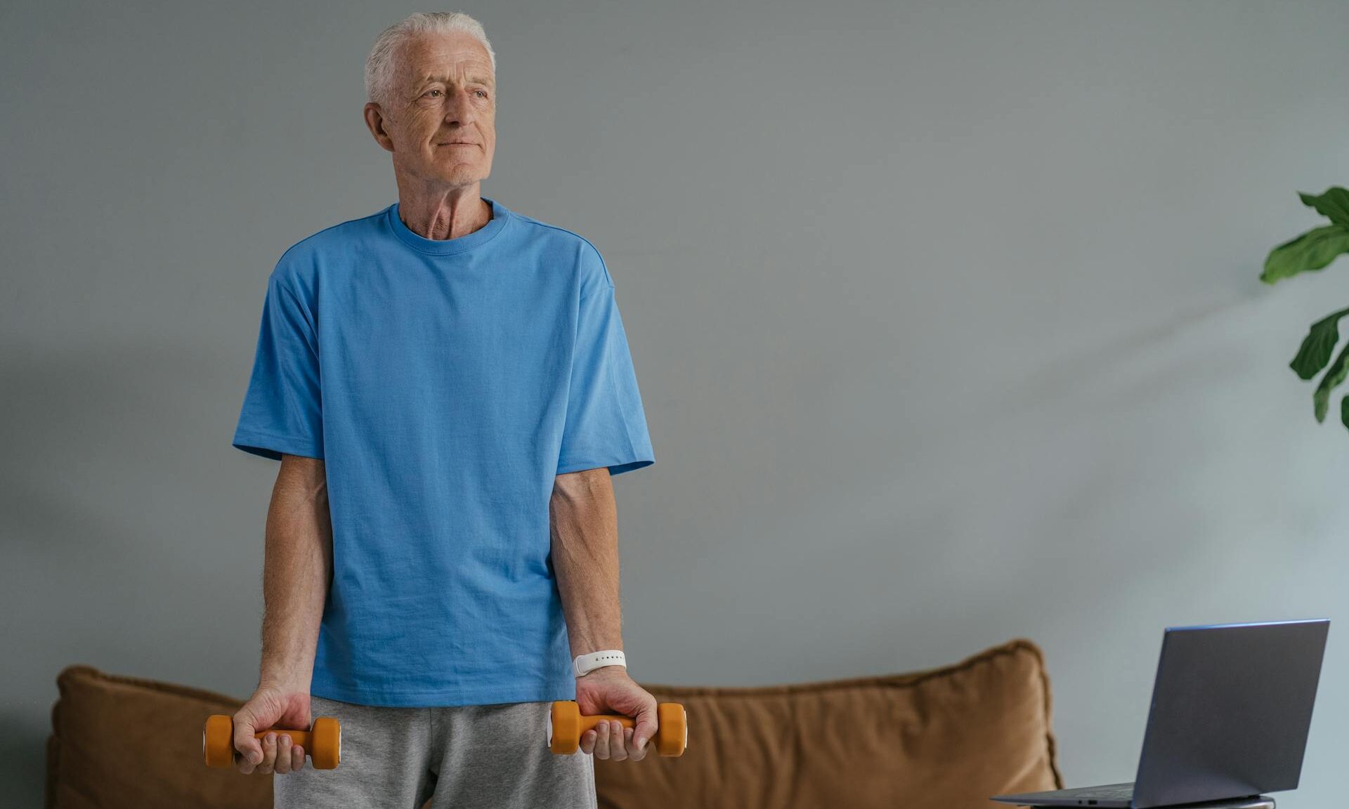 older man lifting weights exercising weightlifting