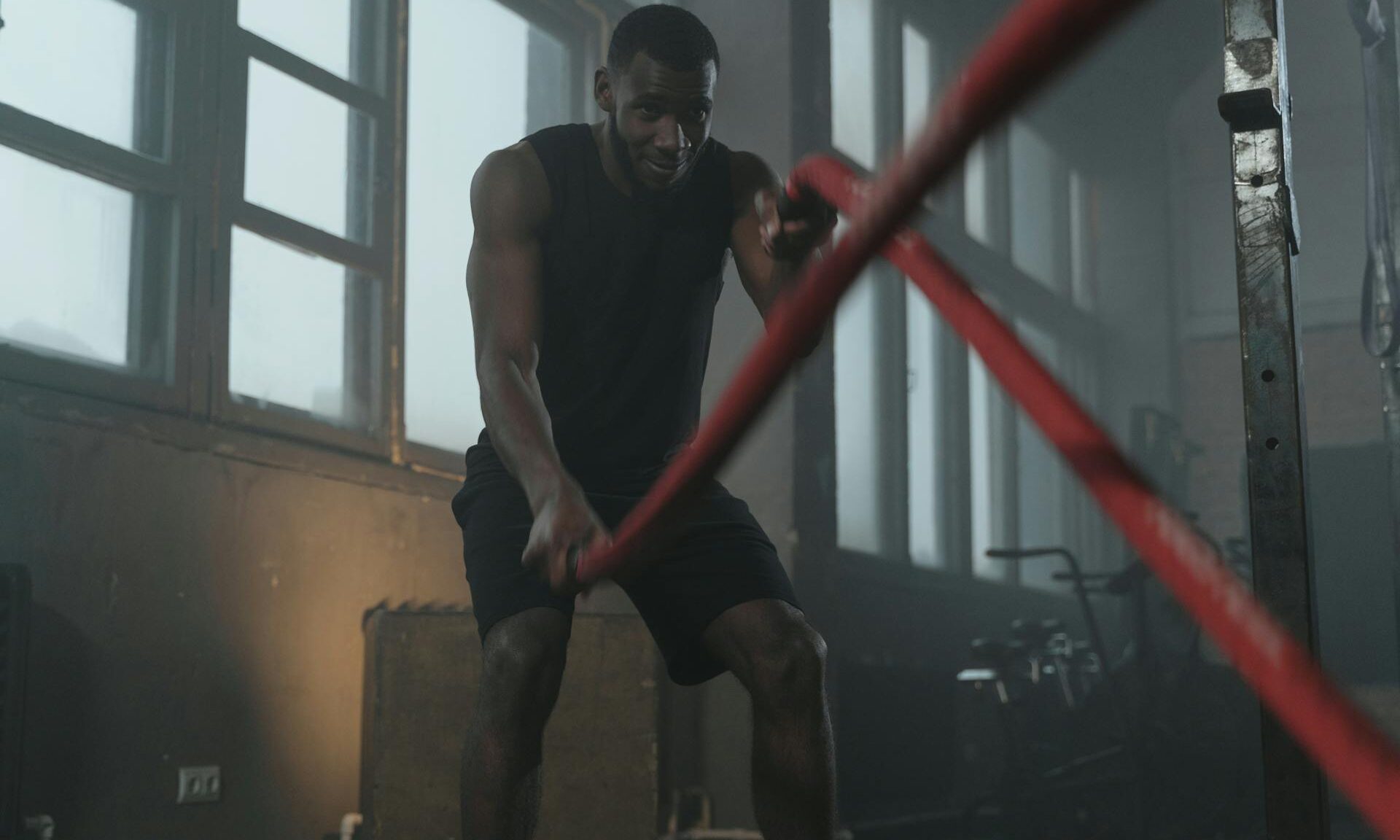 man doing HIIT ropes