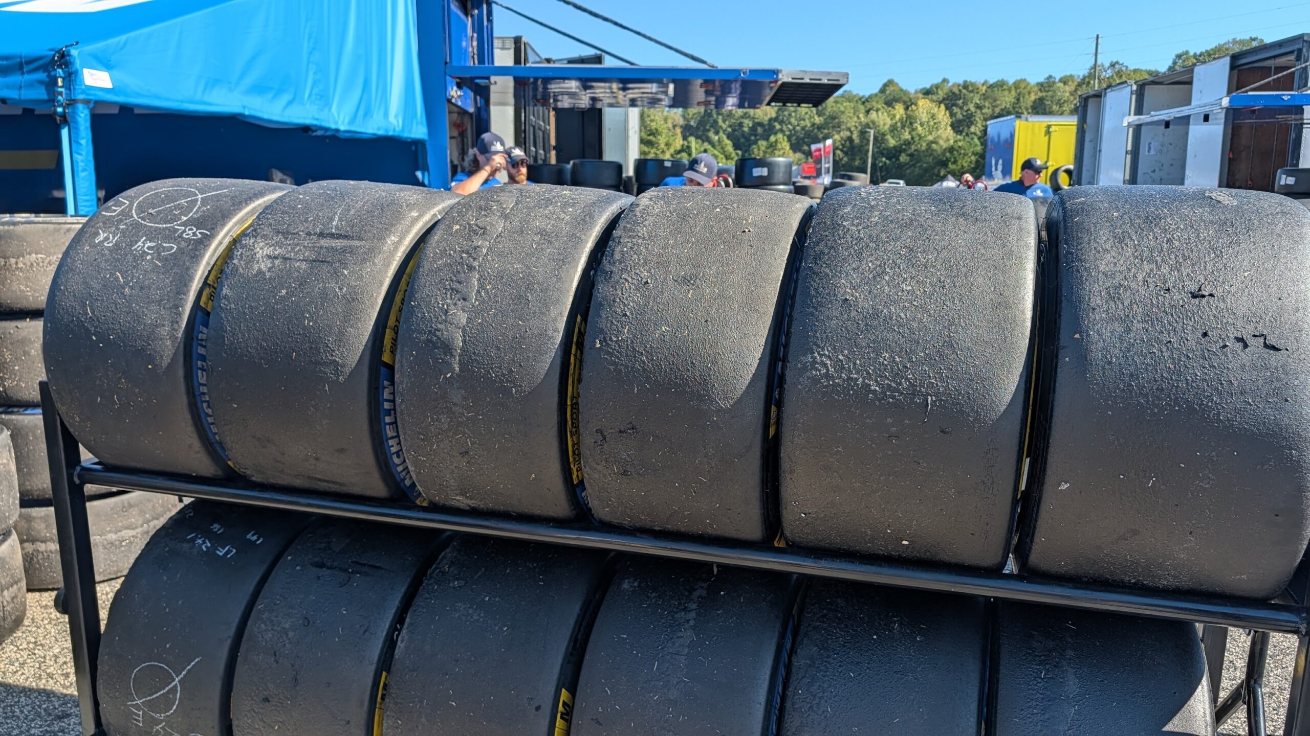 Used michelin race tires on a rack