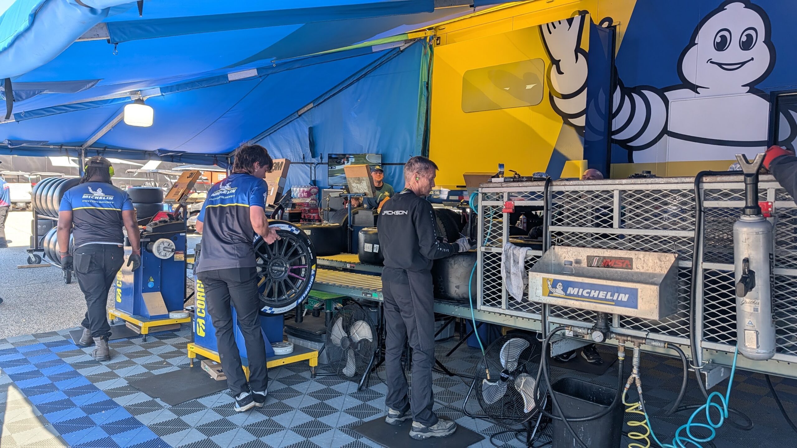 Michelin technicians fitting race tires